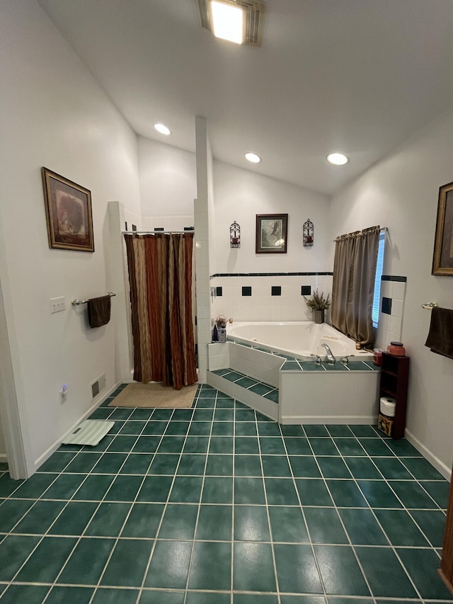 bathroom featuring lofted ceiling and separate shower and tub