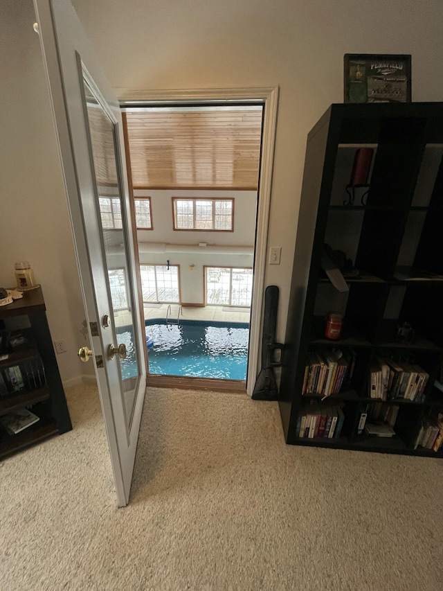 interior space featuring french doors and carpet flooring