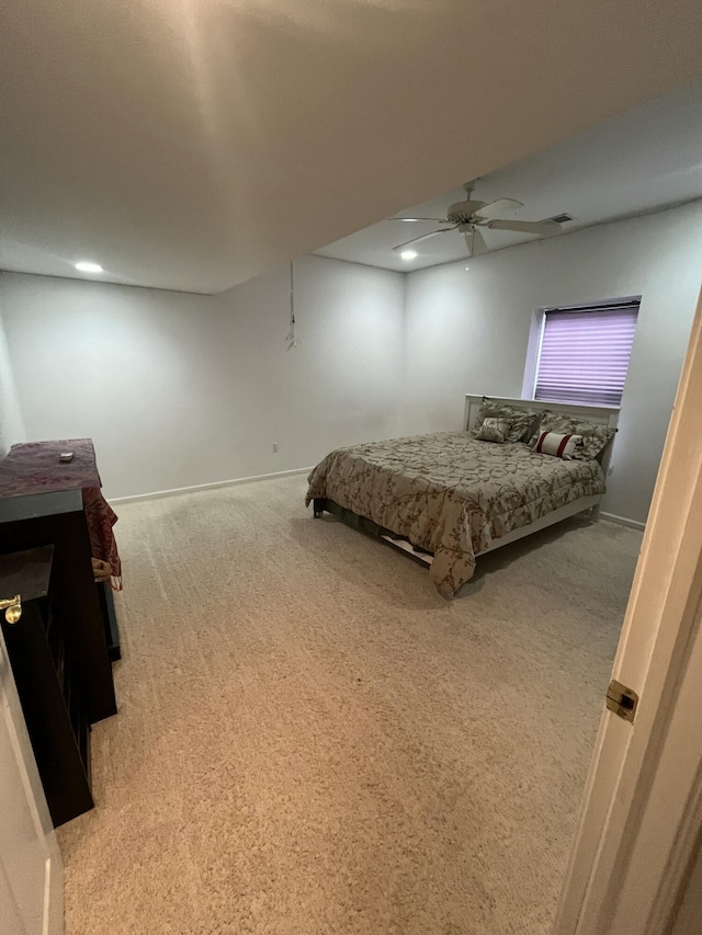 carpeted bedroom featuring ceiling fan