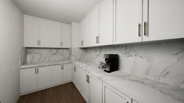 kitchen featuring decorative backsplash, dark hardwood / wood-style floors, light stone counters, and white cabinetry