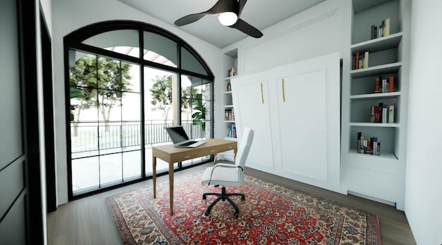 office featuring ceiling fan, hardwood / wood-style flooring, and built in shelves