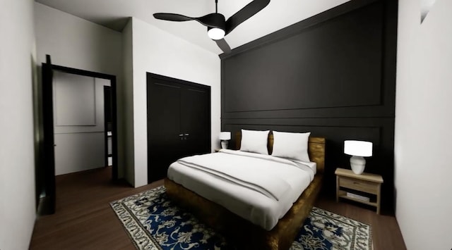 bedroom with ceiling fan and dark hardwood / wood-style floors