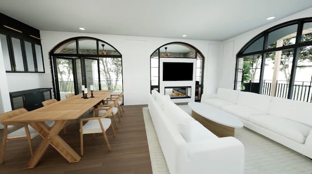 living room featuring a wealth of natural light and hardwood / wood-style flooring