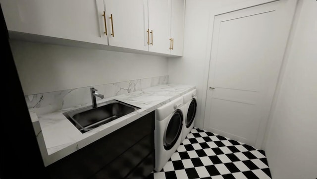 washroom featuring cabinets, sink, and separate washer and dryer