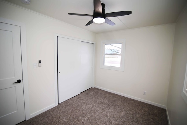 unfurnished bedroom featuring ceiling fan and carpet floors