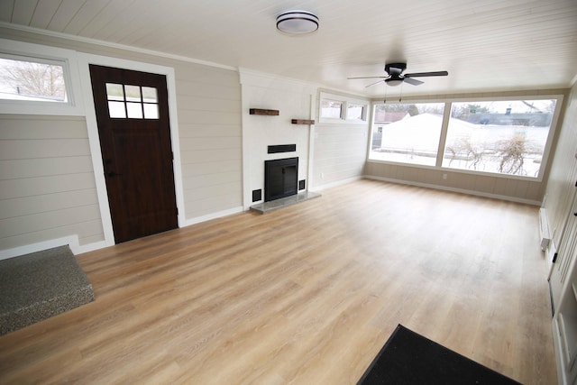 unfurnished living room featuring light hardwood / wood-style floors and ceiling fan