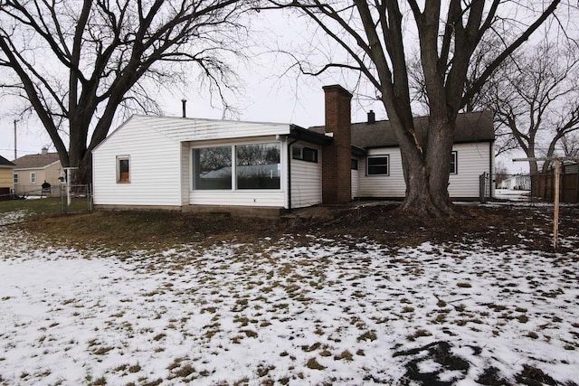 view of snow covered house