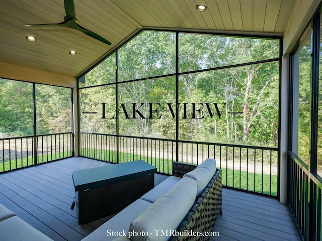 sunroom with vaulted ceiling, wooden ceiling, plenty of natural light, and ceiling fan