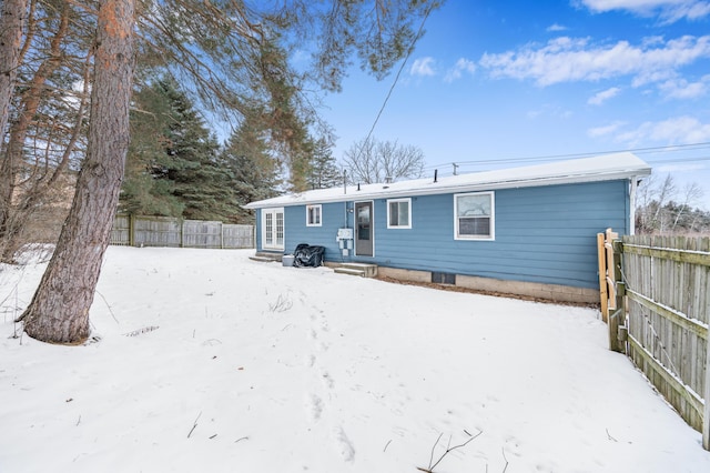 view of snow covered house