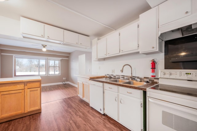 kitchen featuring hardwood / wood-style floors, sink, white cabinets, ceiling fan, and white appliances