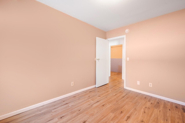 unfurnished room with light hardwood / wood-style flooring