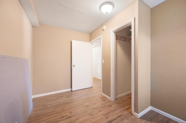 hall with light hardwood / wood-style floors