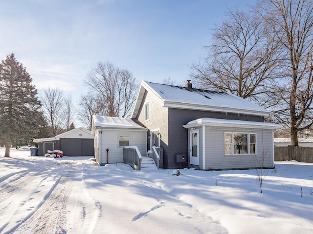 view of snow covered house