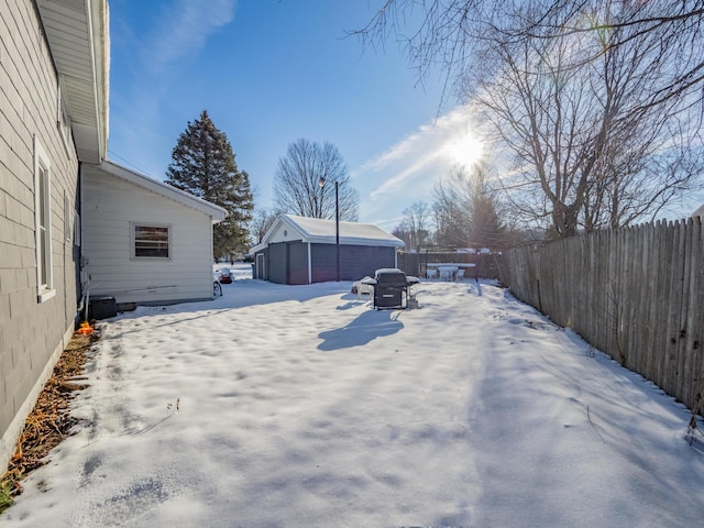 view of yard layered in snow