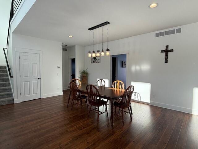 dining space with dark wood-type flooring