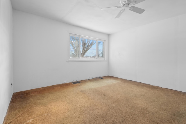 empty room with carpet and ceiling fan