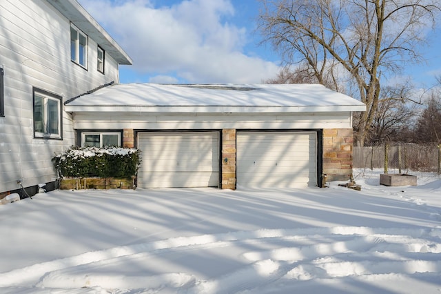 view of snow covered garage