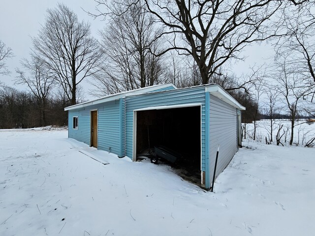 view of snow covered garage