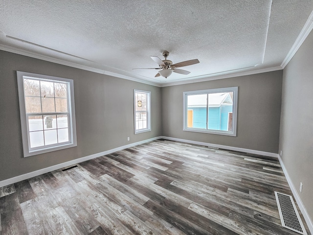 empty room with ceiling fan, crown molding, a textured ceiling, and hardwood / wood-style flooring