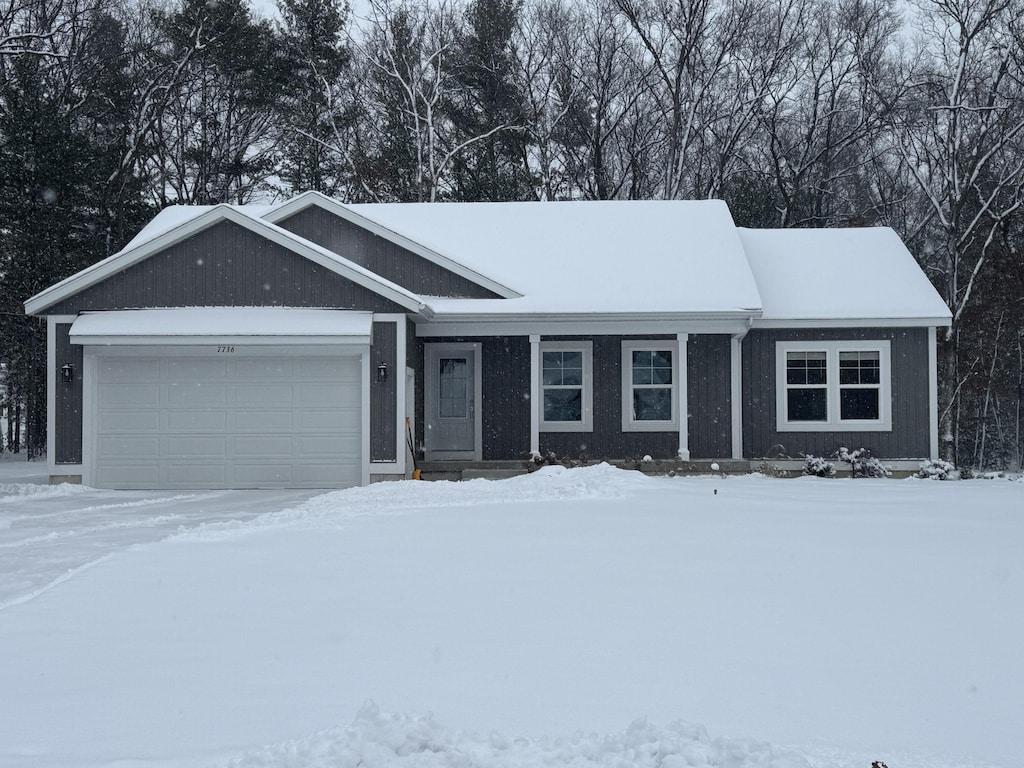 ranch-style house featuring a garage