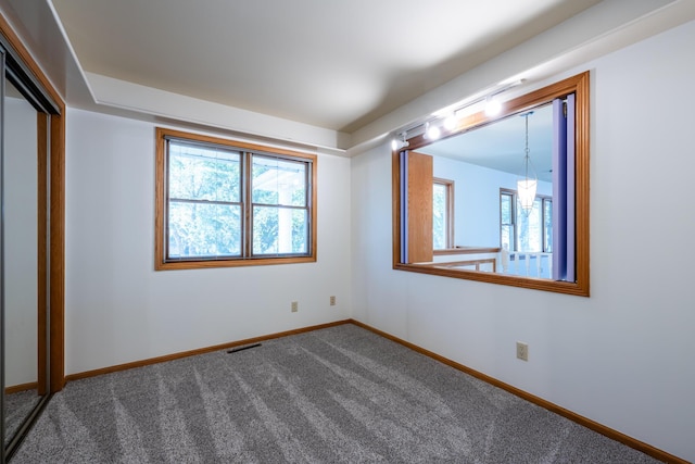 unfurnished bedroom featuring a closet and carpet flooring