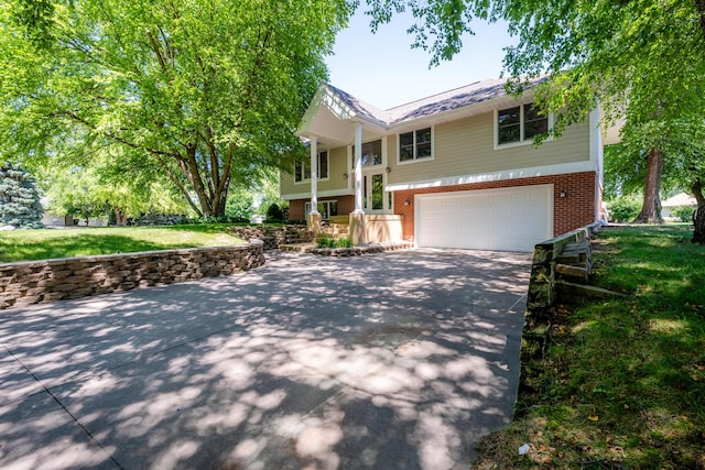 split foyer home featuring a garage