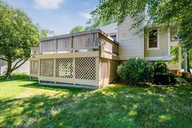 rear view of house featuring a yard