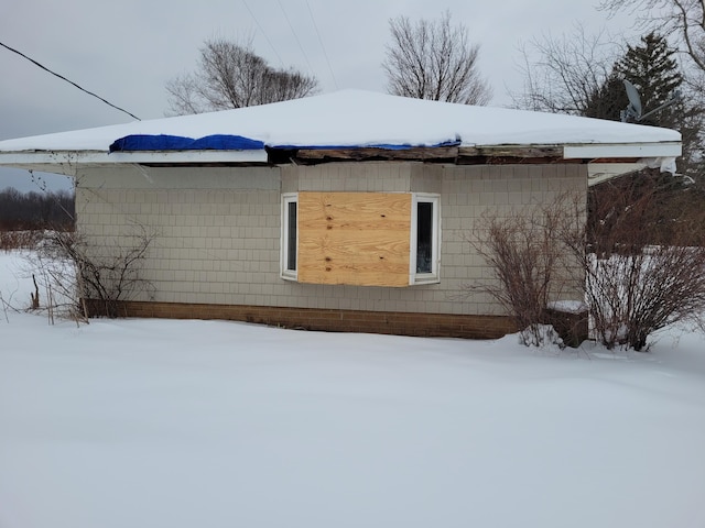 view of snow covered property