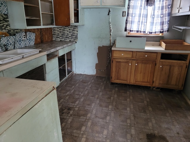 kitchen with decorative backsplash and sink