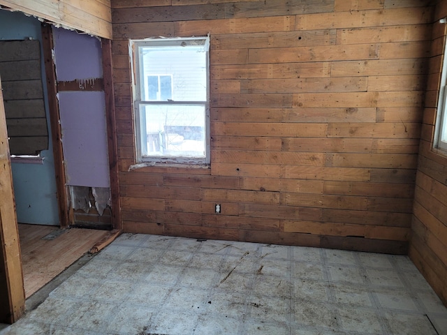 empty room with wood walls