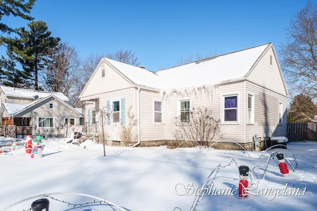 view of snow covered house