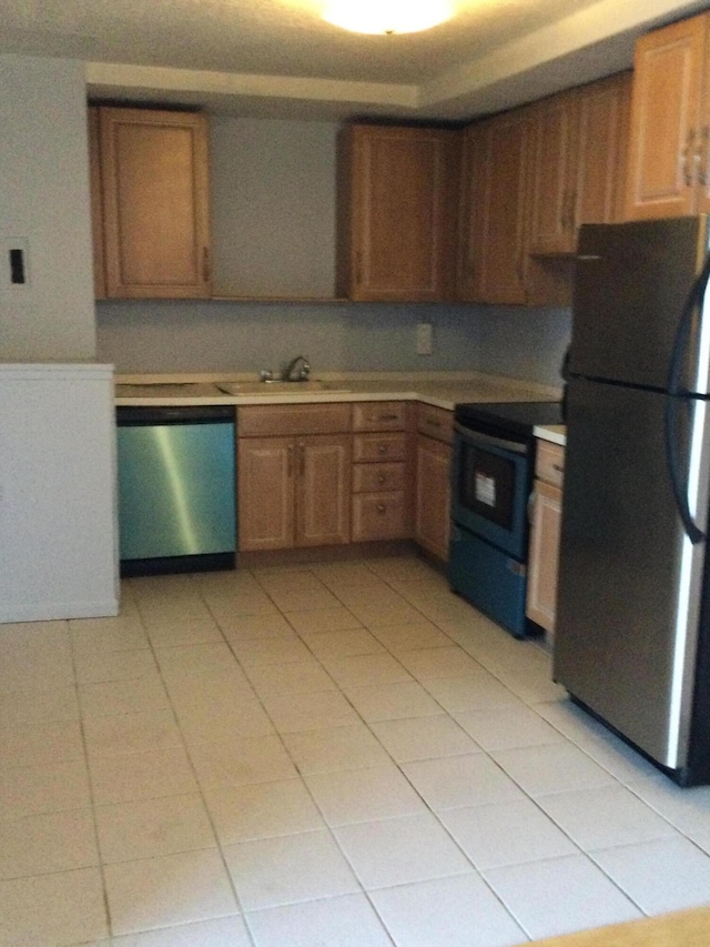 kitchen with sink and appliances with stainless steel finishes