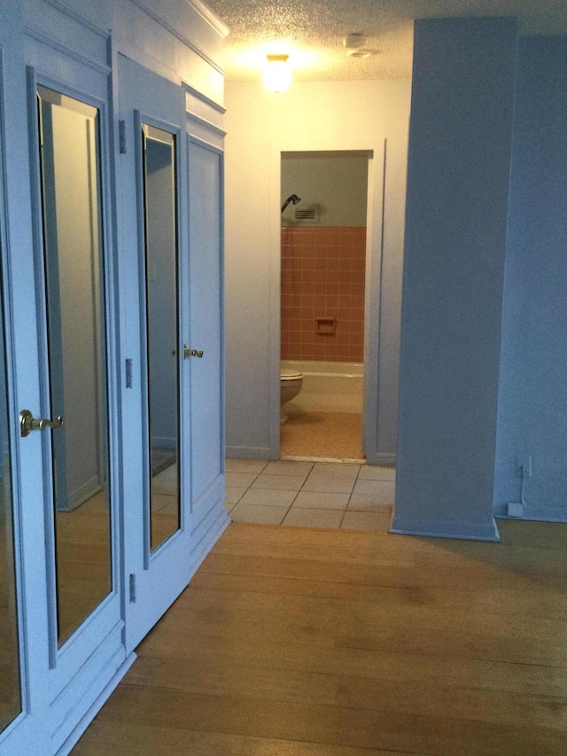 hall featuring tile patterned floors