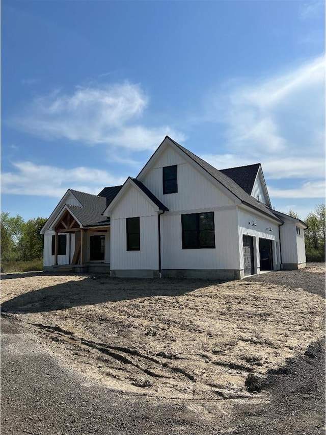 modern farmhouse with a garage