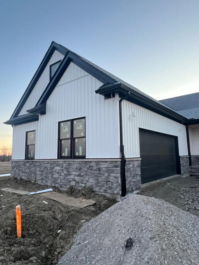 property exterior at dusk with a garage