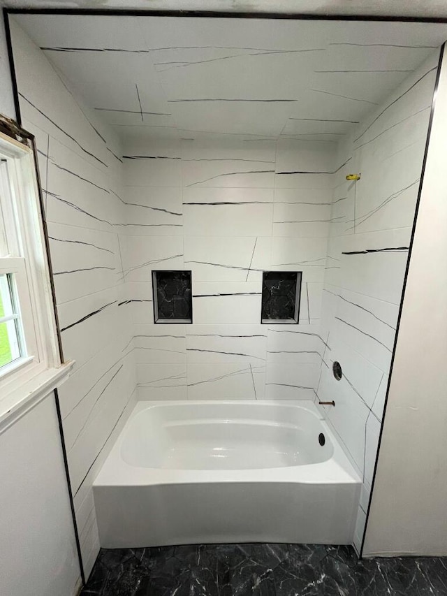 bathroom with bathing tub / shower combination