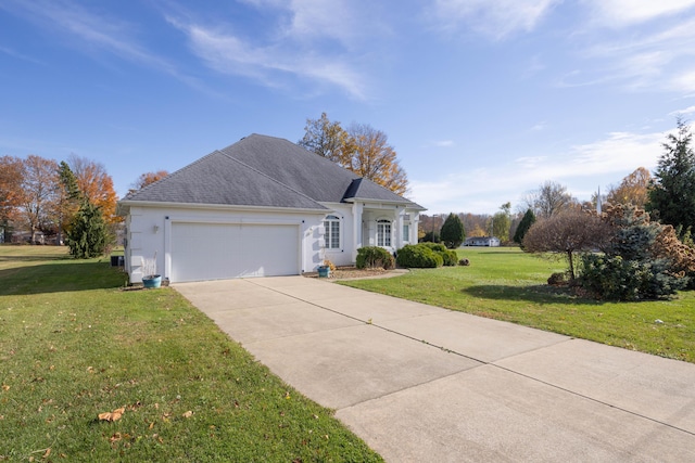 ranch-style home with a front yard and a garage