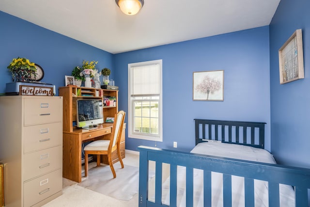 bedroom featuring light colored carpet