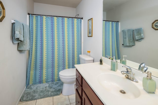 bathroom with vanity, toilet, a shower with curtain, and tile patterned flooring