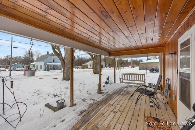 view of snow covered deck