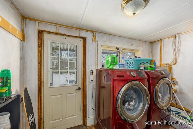 clothes washing area featuring independent washer and dryer