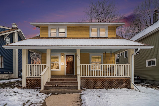 view of front of property featuring covered porch