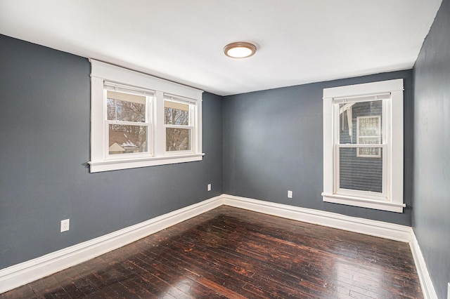 spare room featuring hardwood / wood-style flooring