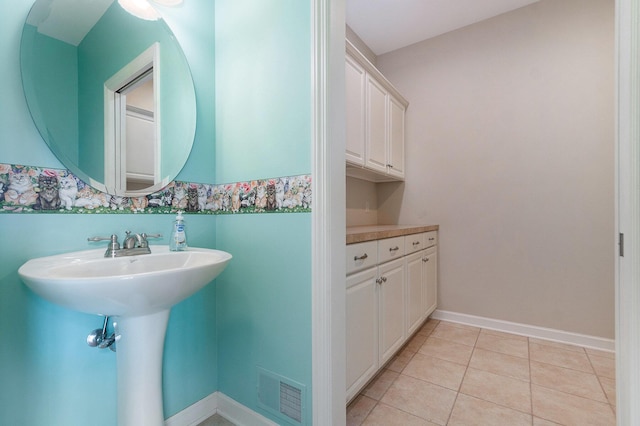 bathroom with tile patterned floors