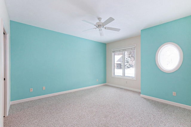 carpeted empty room with ceiling fan