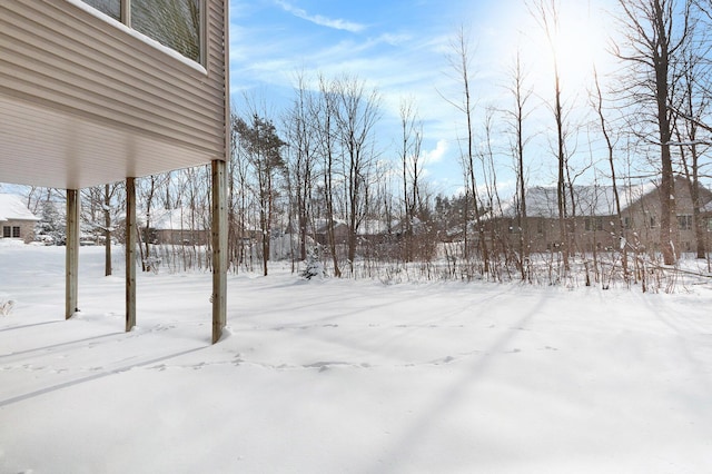 view of yard covered in snow