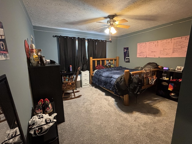 carpeted bedroom featuring ceiling fan and a textured ceiling