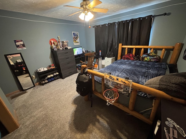 bedroom with a textured ceiling, ceiling fan, and carpet