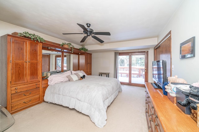 carpeted bedroom featuring access to outside and ceiling fan