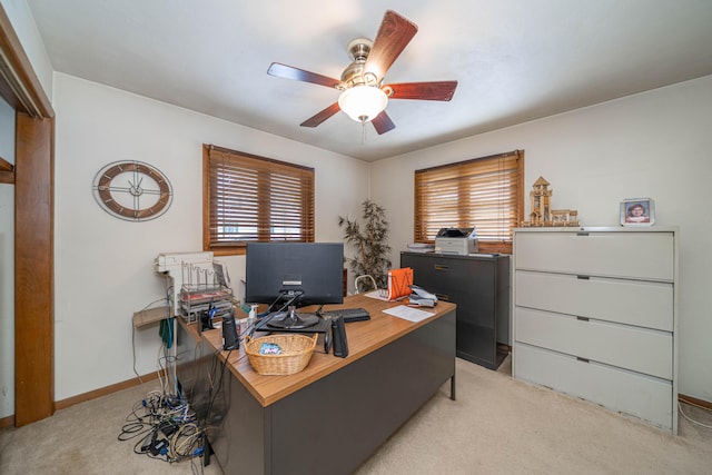 office with light colored carpet and ceiling fan